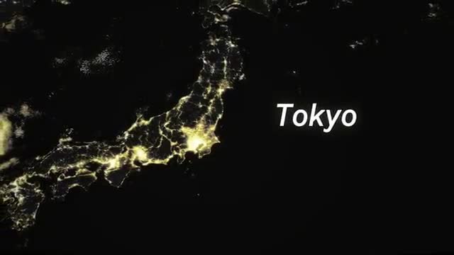 Japan at night, city lights clustered along the coast, with Tokyo the brightest knot.