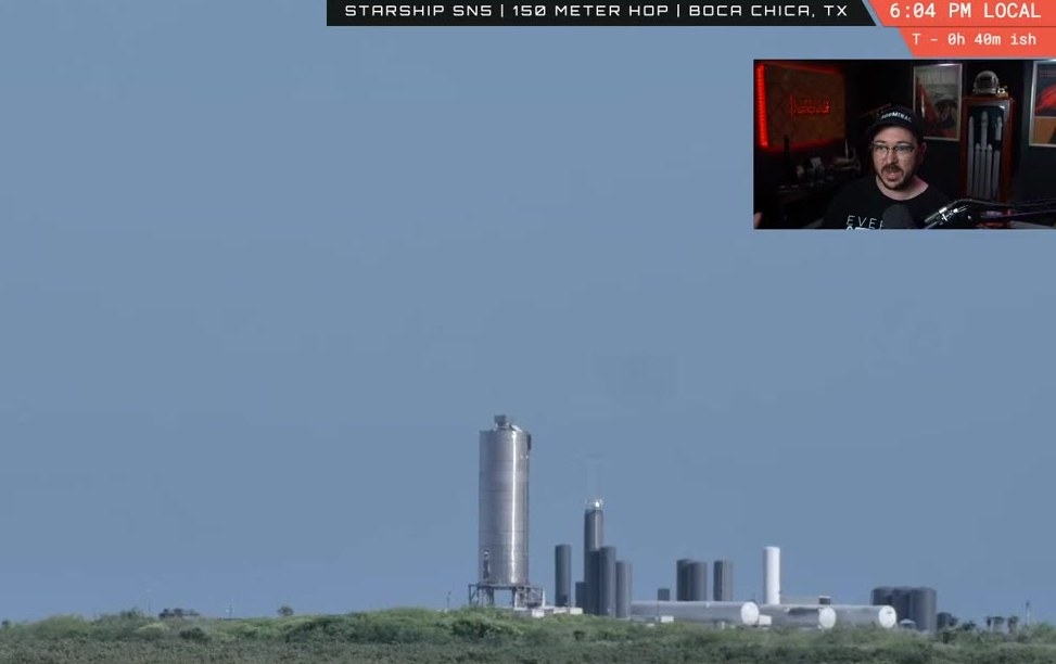 Distant Starship on the pad with the launch tower and tank farm