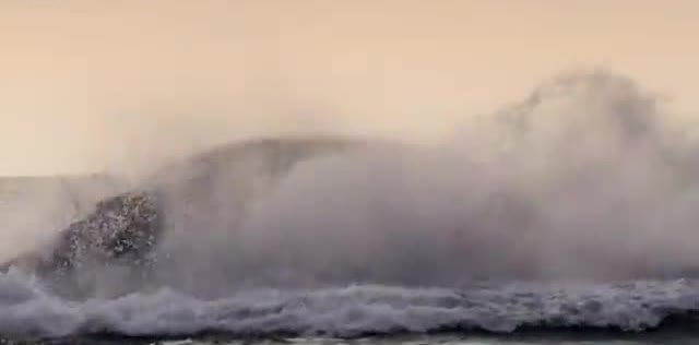 A breaking ocean wave in spray