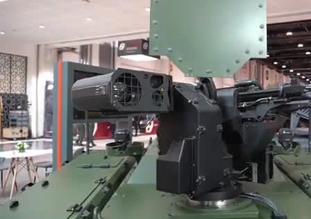 A tracked unmanned ground vehicle with a sensor pod and a gun mount