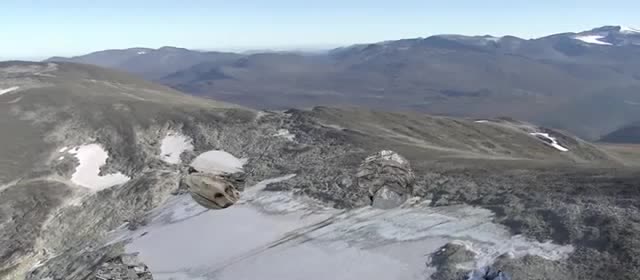 Bare rock and patches of ice on a mountain