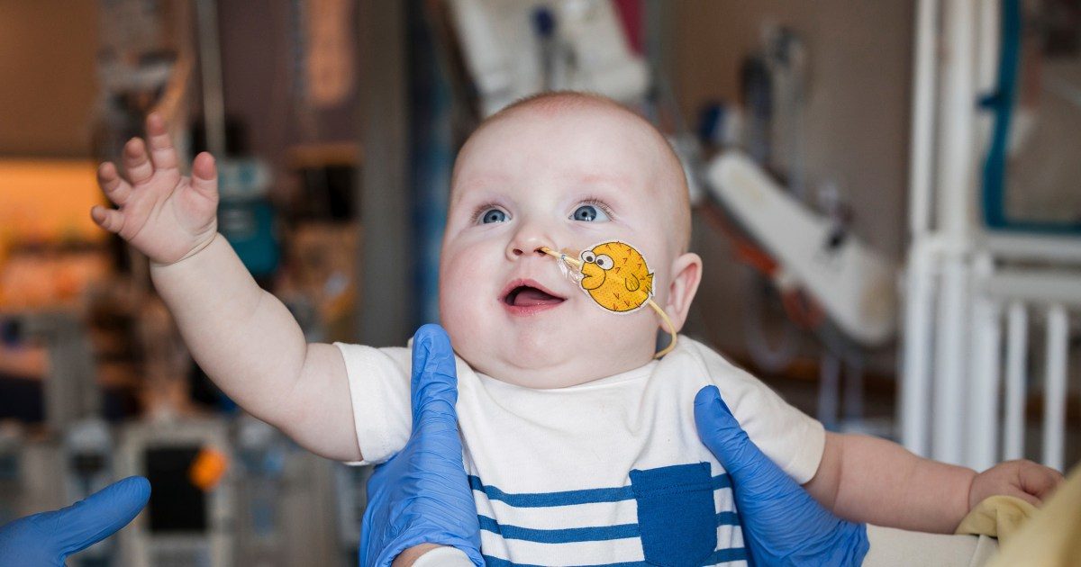 Baby KJ Muldoon smiling in hospital at Children's Hospital of Philadelphia